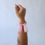 XUXINHA COM LAçO ROSA BEBE | Soulta